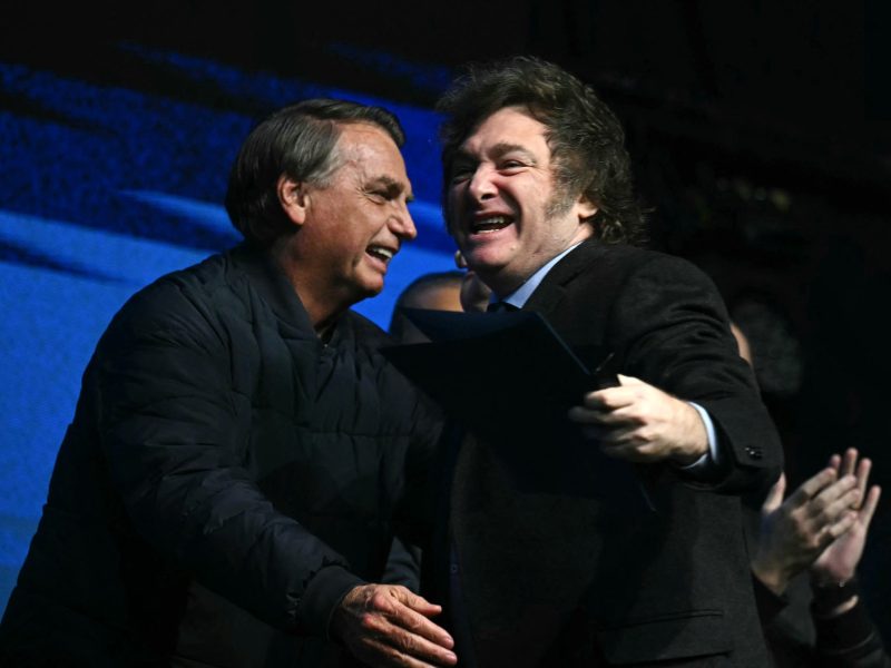 Former Brazilian President Jair Bolsonaro (L) greets Argentina's President Javier Milei during the CPAC Brazil conference in Camboriu, Santa Catarina State, Brazil on July 7, 2024.