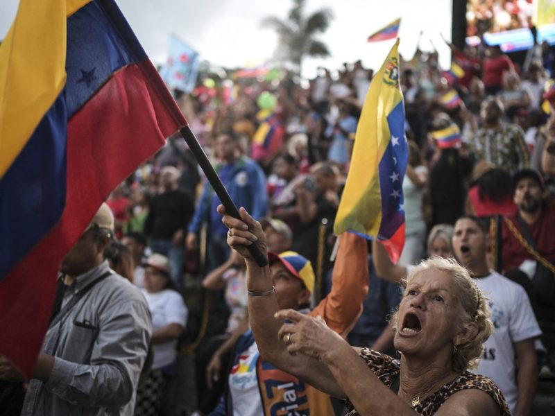Supporters of Venezuelan President Nicolas Maduro shout slogans while they listen to a speech during a rally at the Miraflores presidential palace in Caracas on August 1, 2024. Photo by YURI CORTEZ/AFP via Getty Images